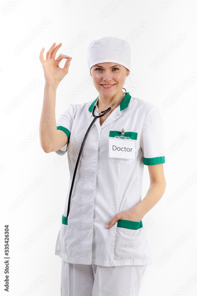 Doctor in a white robe with a stethoscope in his hands. Doctor in a white robe with a stethoscope in his hands.