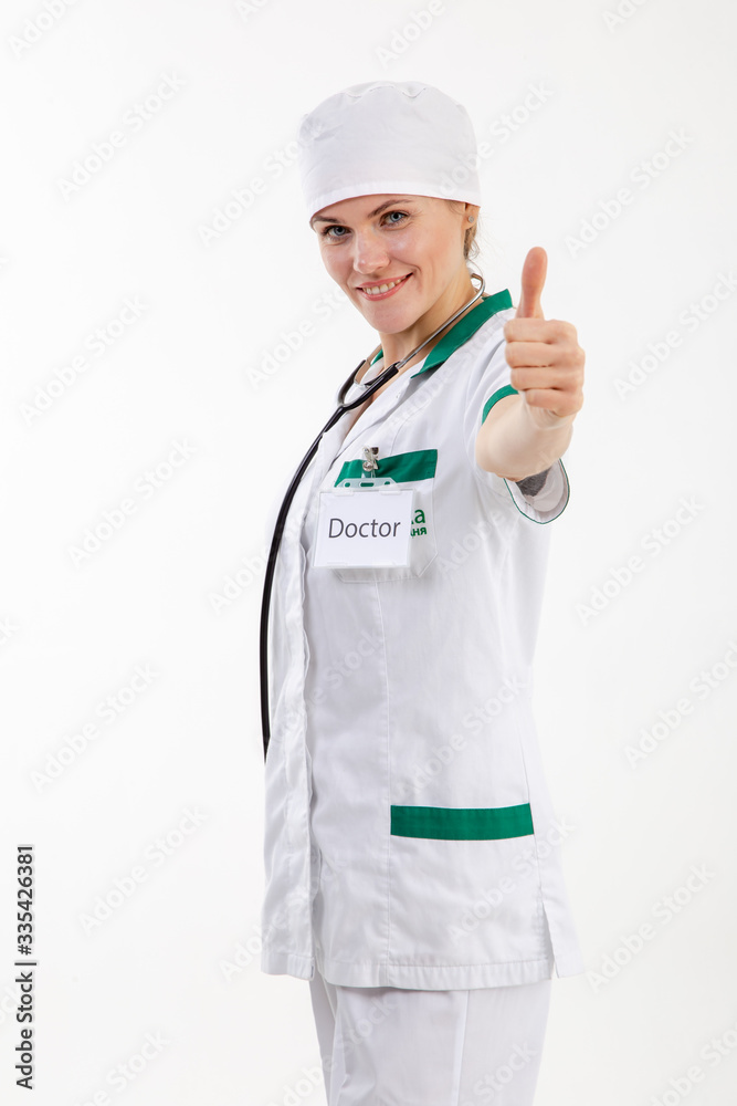 Doctor in a white robe with a stethoscope in his hands. Doctor in a white robe with a stethoscope in his hands.