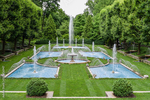 Blue Fountains with Grass Fields and Tree Surroundings