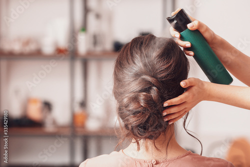 Hairdresser working with yo...