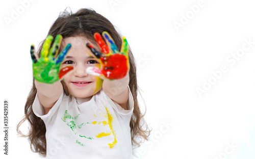 little girl with painted hands