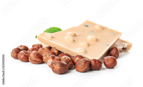 Sweet chocolate with nuts on white background