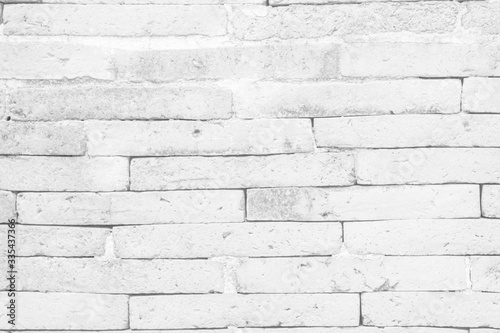 White brick wall texture background in room at subway. Brickwork