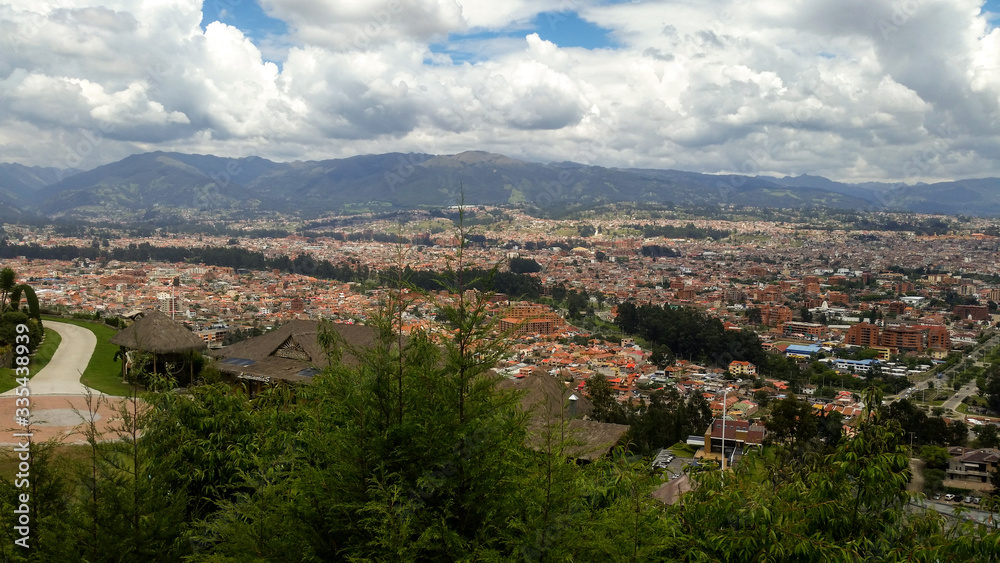 
View of the colonial city from the viewpoint on a partially sunny day.