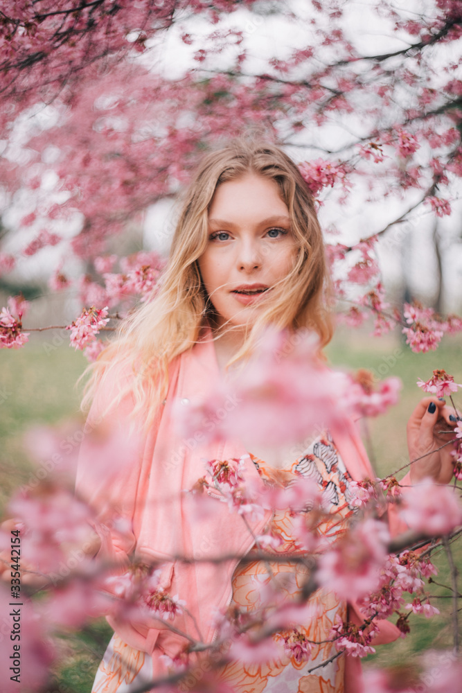 Girl in a cherry blossom garden Girl in a cherry blossom garden