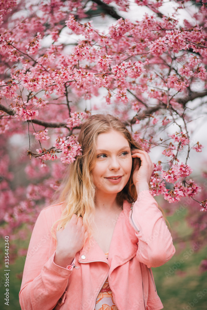 Girl in a cherry blossom garden Girl in a cherry blossom garden