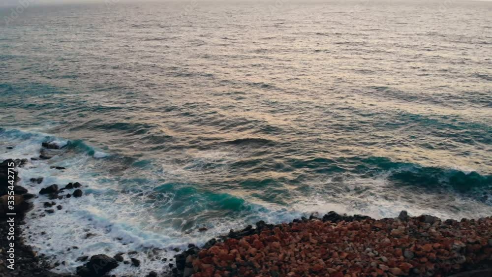 Sea with waves on a rocky shore. Sea with waves on a rocky shore.