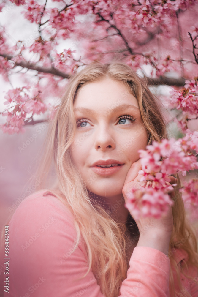 Girl in a cherry blossom garden Girl in a cherry blossom garden