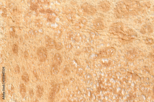 Texture of thin traditional freshly baked homemade italian bread. Close-up pita bread as a textured bread background.