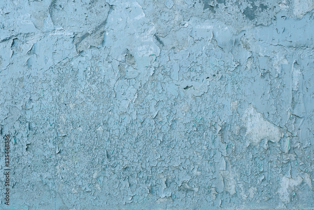 Surface Of Concrete Wall With Stains And Streaks Of Blue And White Paint, Cracks And Roughness. Grunge Background For Design.
