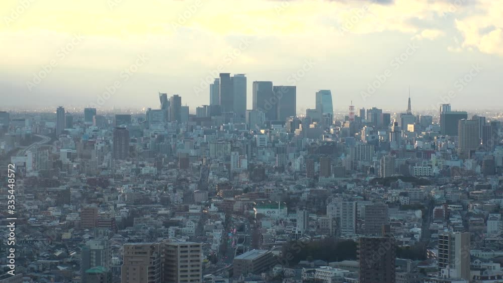 NAGOYA, AICHI, JAPAN - FEB 2020 : Aerial high angle view of cityscape of Nagoya city. View of buildings and street traffic around central downtown area. Time lapse shot sunset to night. NAGOYA, AICHI, JAPAN - FEB 2020 : Aerial high angle view of cityscape of Nagoya city. View of buildings and street traffic around central downtown area. Time lapse shot sunset to night.