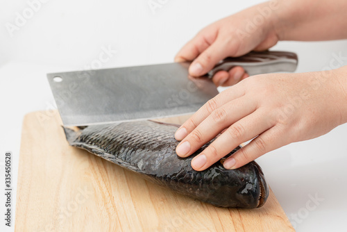 Tilapia is a eviscerated fish with a knife.