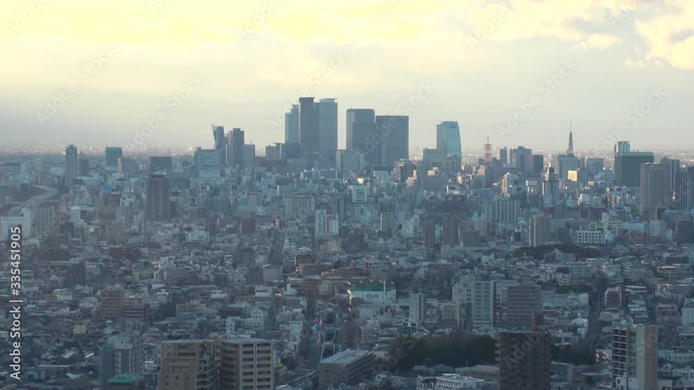 NAGOYA, AICHI, JAPAN - FEB 2020 : Aerial high angle view of cityscape of Nagoya city. View of buildings and street traffic around central downtown area. Time lapse shot sunset to night. NAGOYA, AICHI, JAPAN - FEB 2020 : Aerial high angle view of cityscape of Nagoya city. View of buildings and street traffic around central downtown area. Time lapse shot sunset to night.