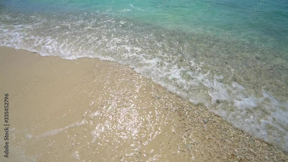 White sand an exotic tropical beach, view of waves break on tropical white sand beach. White sand an exotic tropical beach, view of waves break on tropical white sand beach.