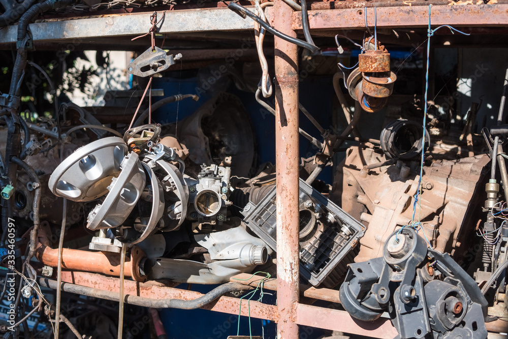 Fototapeta premium Old car spare parts for sale in garage