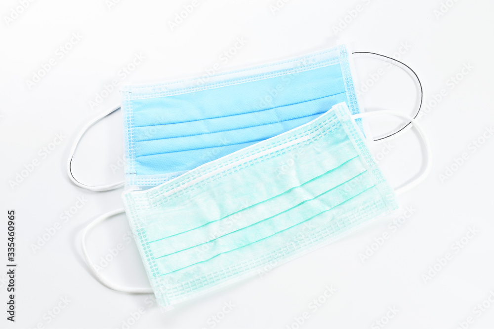 Blue sanitary mask on the white background. Blue sanitary mask on the white background.