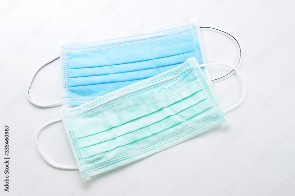 Blue sanitary mask on the white background. Blue sanitary mask on the white background.
