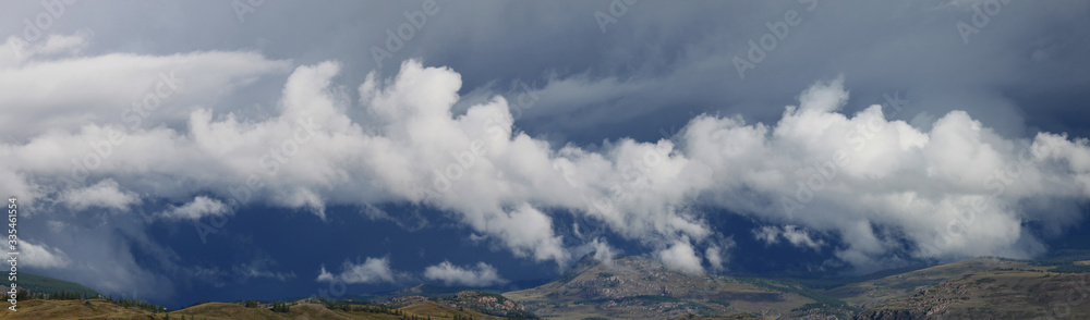 Mountains in the clouds, bad weather, natural light, wide view