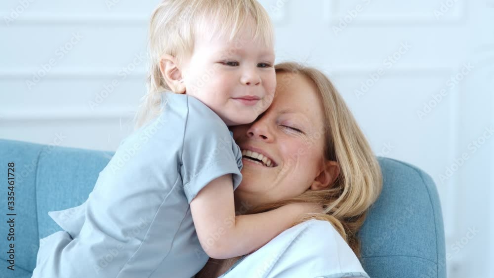 Mom with a little son play fun at home. Happy childhood concept Mom with a little son play fun at home. Happy childhood concept