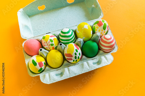 Painted Easter eggs in a box. Watercolor paint.