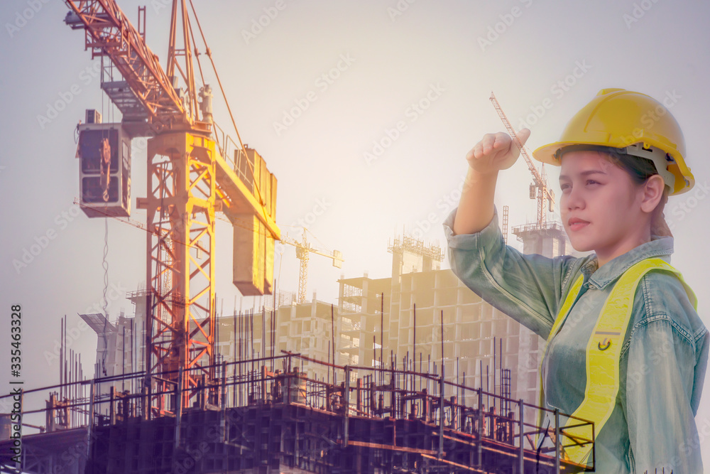 Asian engineer woman look Successful with her job. Asian architect looking at the distance to lead to success with yellow helmet and jean shirt. Concept Engineer and business work, duplicate photo. Asian engineer woman look Successful with her job. Asian architect looking at the distance to lead to success with yellow helmet and jean shirt. Concept Engineer and business work, duplicate photo.