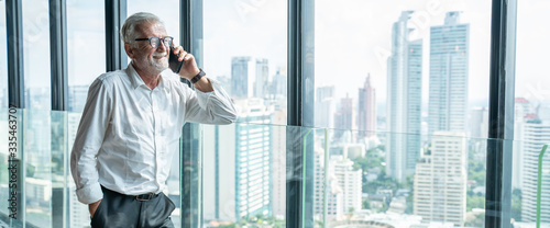 Obraz na plátne Elderly grey-haired businessman in white shirts are happily calling because they