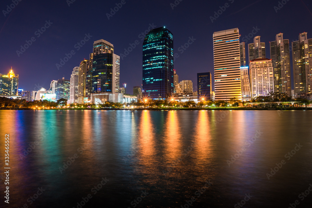 Modern building light with pond public park at night Modern building light with pond public park at night