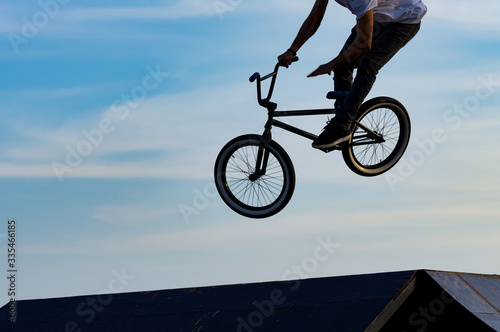 BMX bicycle + jump off ramp