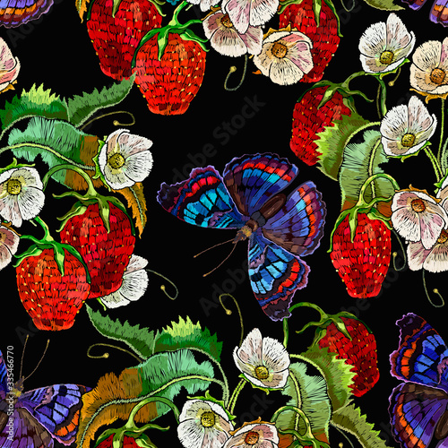 Strawberry plant with leaves, red berries, white flowers and colorful butterflies. Embroidery seamless pattern. Fashion template for clothes, textiles and t-shirt design. Summer garden art
