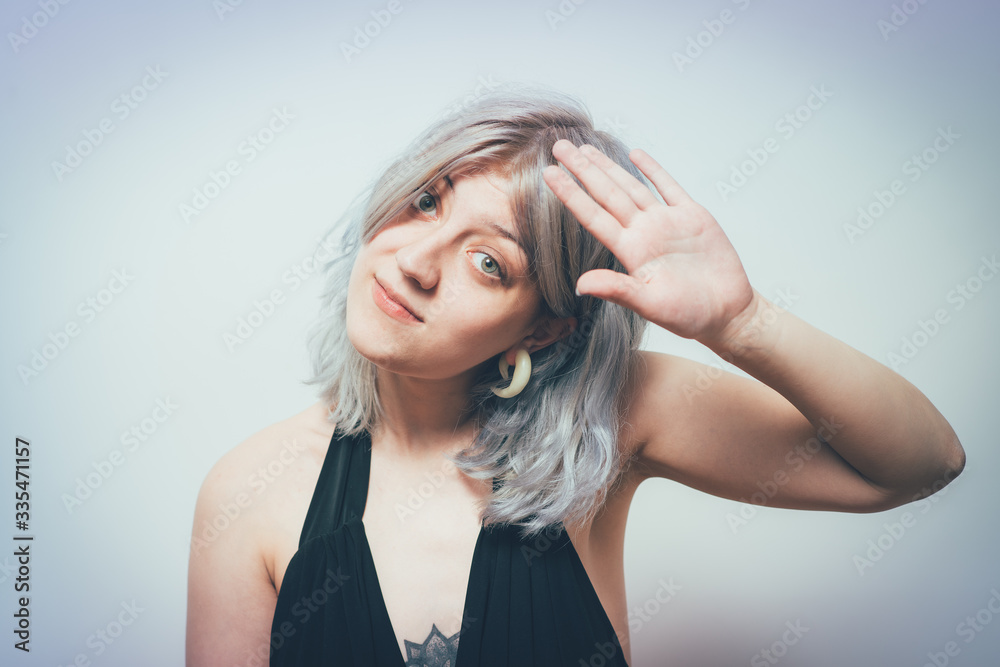 Portrait of a woman smiling and saying hello Portrait of a woman smiling and saying hello