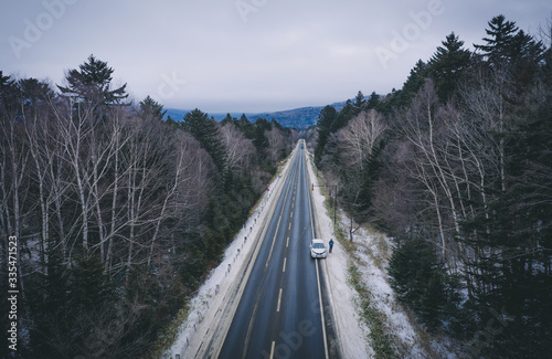road trip across wild forest in Hokkaido in winter time