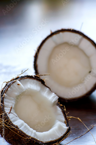 coconut cut into two pieces stock photo