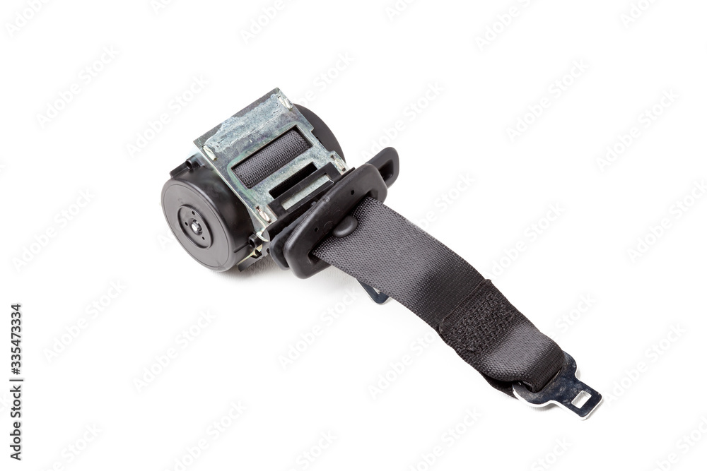 Spare part and interior element black seat belt from a car on a white isolated background. Auto service industry. Spare part and interior element black seat belt from a car on a white isolated background. Auto service industry.