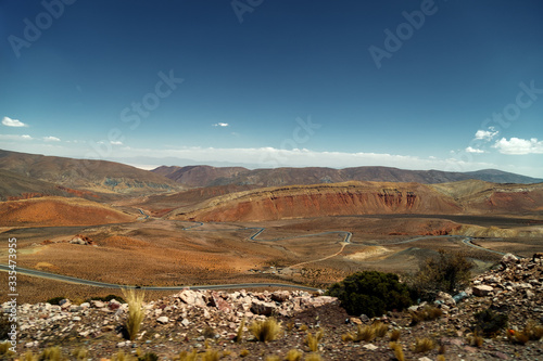 Winding road seen from above in a valley near Purmamarca, Jujuy, Argentina © simonmayer