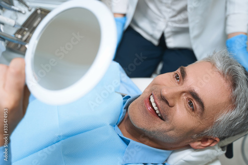 Happy man after dental procedures stock photo photo