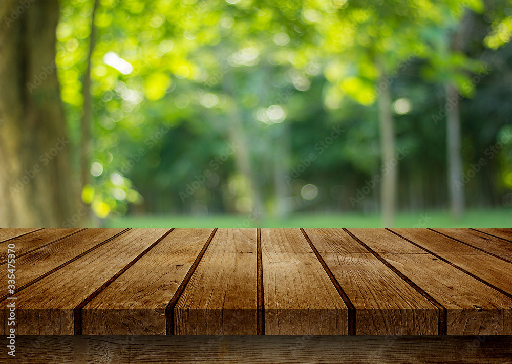 empty wooden table on green background empty wooden table on green background