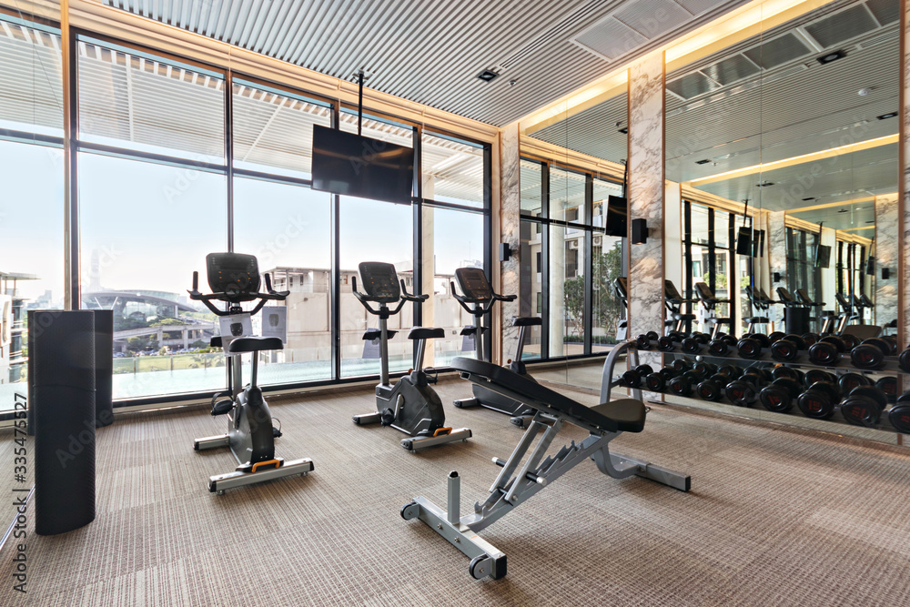 Equipment in modern gyms fitness with city and sky view