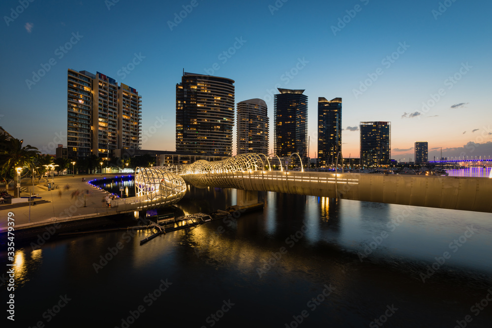 Naklejka premium Webb Bridge and Docklands district in Melbourne at sunset