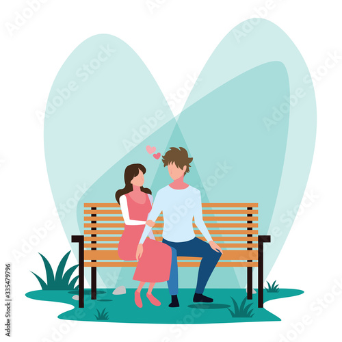 couple of people in love sitting in the park chair