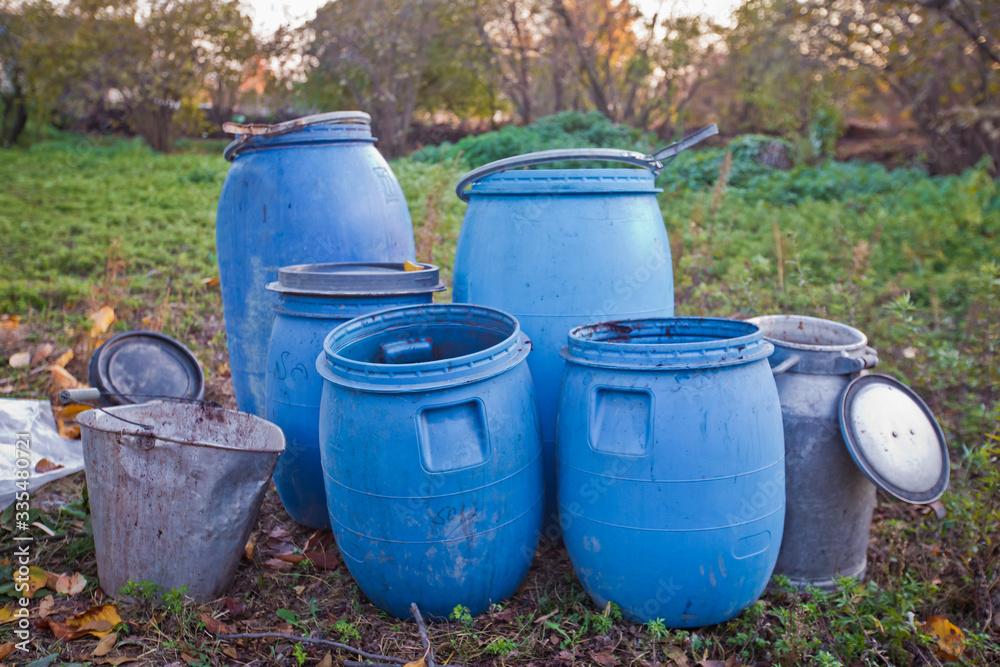The blue plastic barrels for storage of chemicals . Stockpile of used blue plastic drums for storing water and other liquids. Chemical Plant, Plastic Storage Drums, Big Blue Barrels . The blue plastic barrels for storage of chemicals . Stockpile of used blue plastic drums for storing water and other liquids. Chemical Plant, Plastic Storage Drums, Big Blue Barrels .