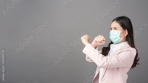 Business woman is wearing surgical mask , business protection concept