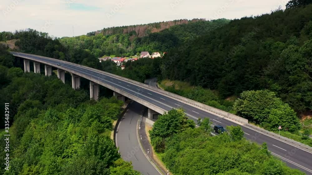 Aerial view of road between forest and small city in Germany Aerial view of road between forest and small city in Germany