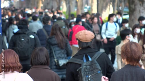 Wallpaper Mural SHIBUYA WARD, TOKYO, JAPAN - FEB 2020 : View of back shot of unidentified crowd of people enjoying shopping at Harajuku, Omotesando area. Shot in busy weekend. Holiday concept. Slow motion shot. Torontodigital.ca