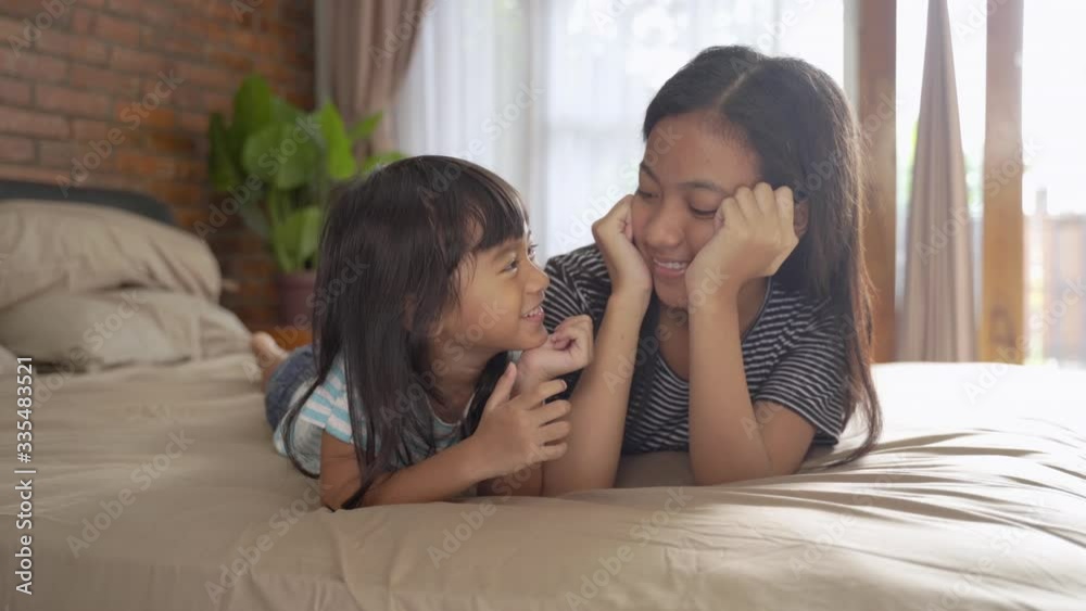 asian cute happy sibling sister smiling to camera asian cute happy sibling sister smiling to camera