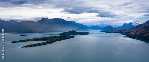 Dark and Grim Lake Wakatipu and Southern Alps Mountains after sunset © donvictori0