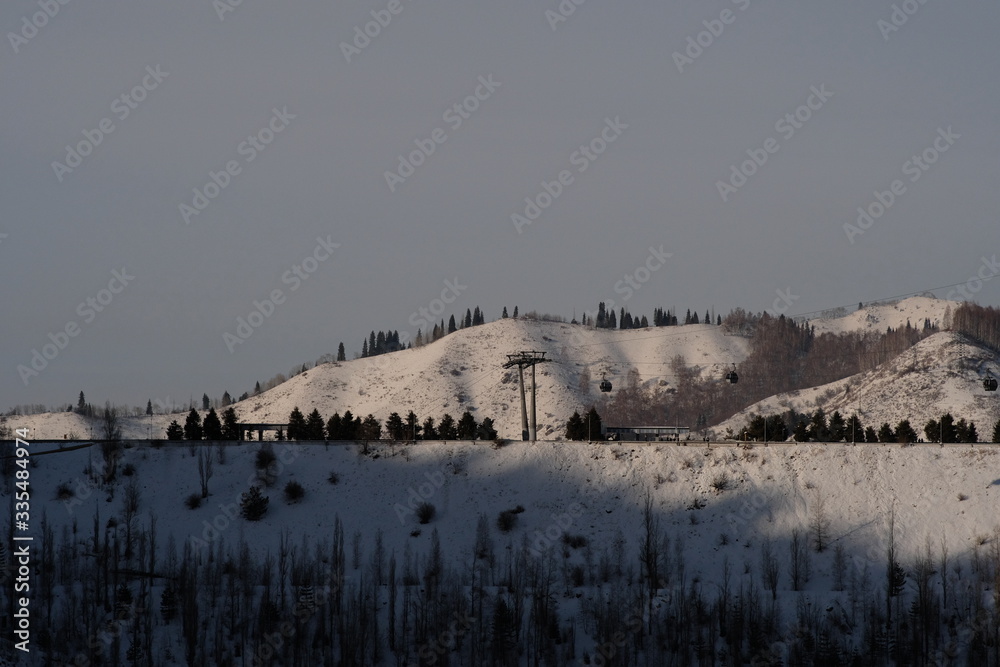Medeo or Medeu dam in winter evening. Winter landscape.