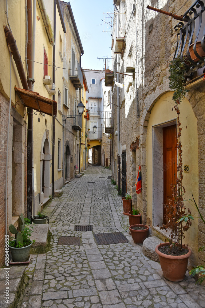 Guardia Sanframondi, Italy, 04/30/2018. A narrow street among the small houses of a medieval village in the Campania region