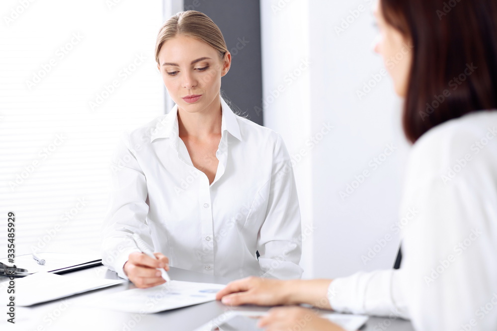 Group of business people or lawyers discussing terms of transaction in office. Colleagues working all together. Meeting concept Group of business people or lawyers discussing terms of transaction in office. Colleagues working all together. Meeting concept