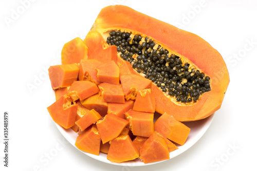 Papaya fruit peel in a plate on white background