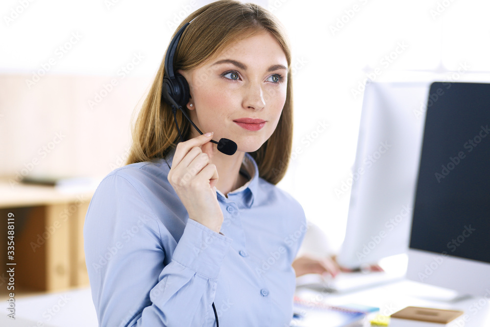 Portrait of call center operator at work. Group of people in a headset ready to help customers. Business concept Portrait of call center operator at work. Group of people in a headset ready to help customers. Business concept